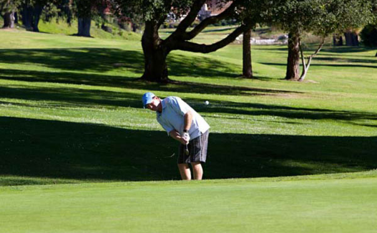 view of golfer on green